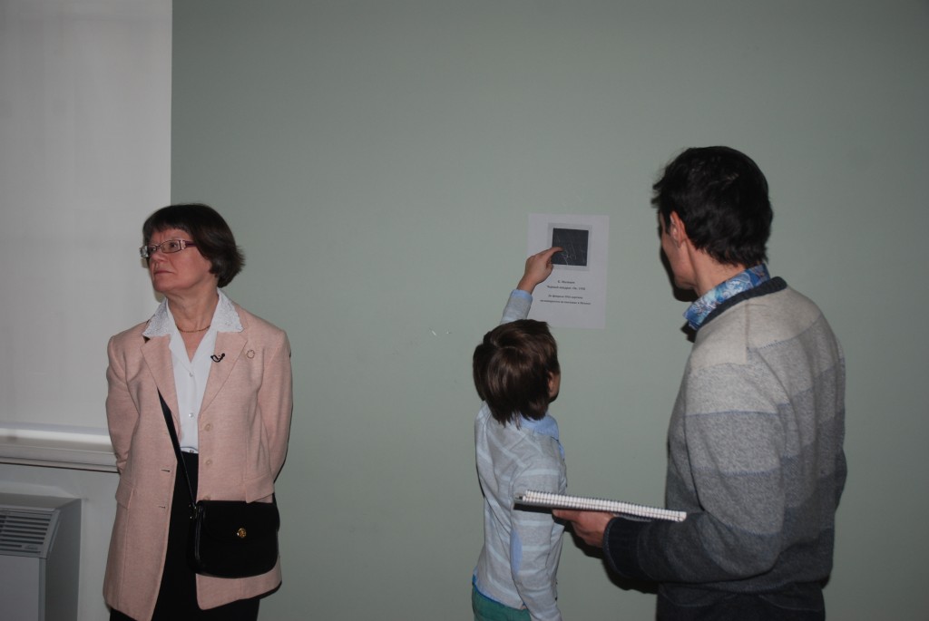 Daniil Ahr pointing absent Malevich painting at Ermitage